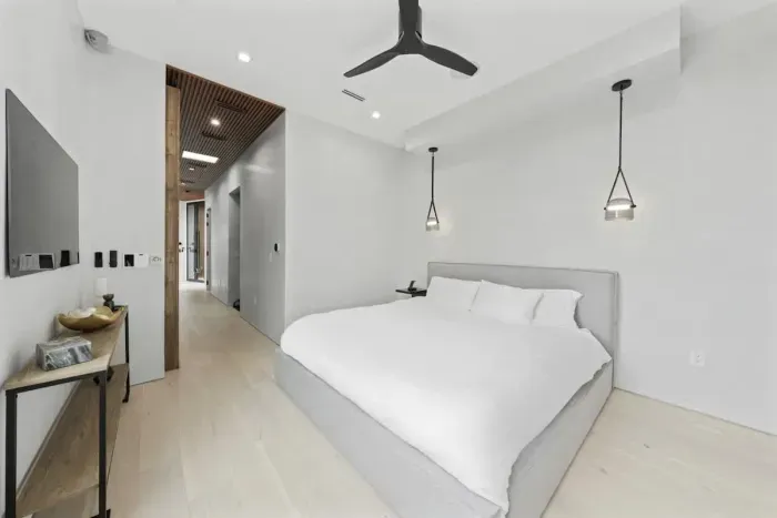 A king-size bed, high-end linens, and elegant decor make this room a luxurious retreat for relaxation.