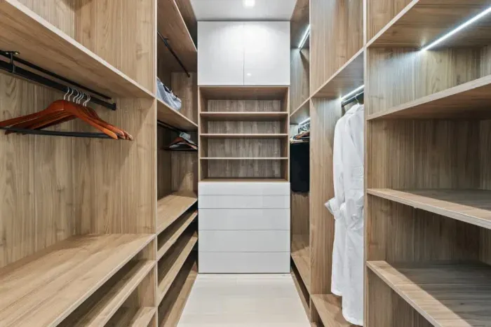 A spacious closet where style meets serenity, transforming daily routines into moments of luxury.