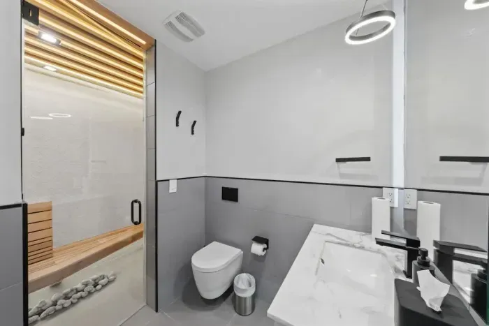 Simple yet elegant bathroom with a minimalist design and all the essentials.
