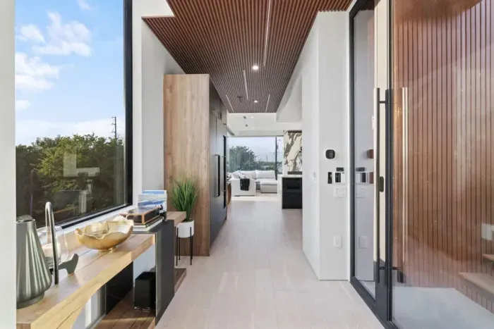 Thoughtful design runs throughout the home, light-filled hallways, wood accents, and seamless flow into the main living spaces