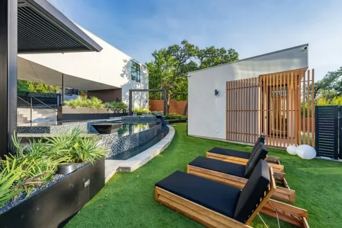 Vibrant backyard with a colorful mix of plants and flowers, creating a bright and cheerful atmosphere.