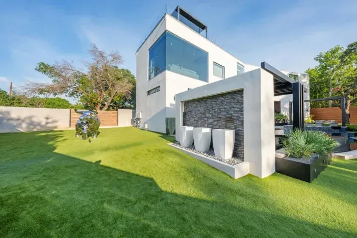 Family-friendly backyard with a play area, plenty of green space, and outdoor seating.