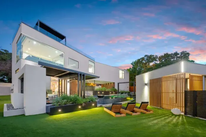 Modern home with sleek lines, large windows, and a minimalist design.