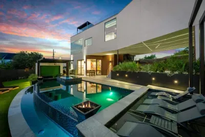 Private backyard oasis featuring a large deck, comfy seating, and a fire pit for cozy evenings.