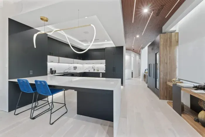 Spacious kitchen with a large island and seating, ideal for enjoying morning coffee or group meal prep.