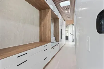 This cleverly designed clothing storage in the second bedroom transforms everyday essentials into an artful display, merging function with flair.