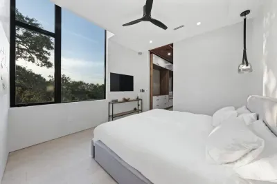 Modern neutral decor, and artistic touches make this room an effortlessly chic and peaceful escape.