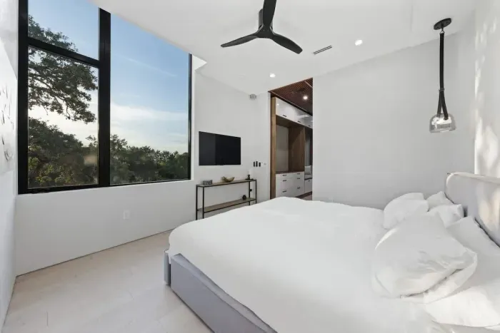 Modern neutral decor, and artistic touches make this room an effortlessly chic and peaceful escape.