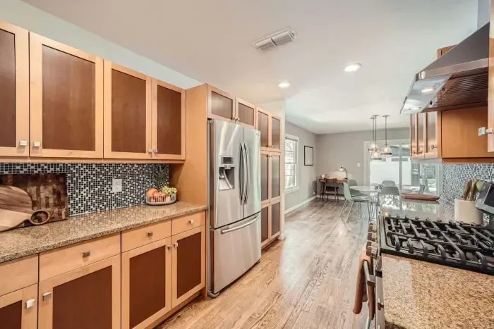 Warm and inviting kitchen with beautiful countertops and all the comforts of home.