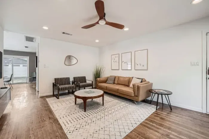 Equipped with a large TV, cozy seating, and space for everyone