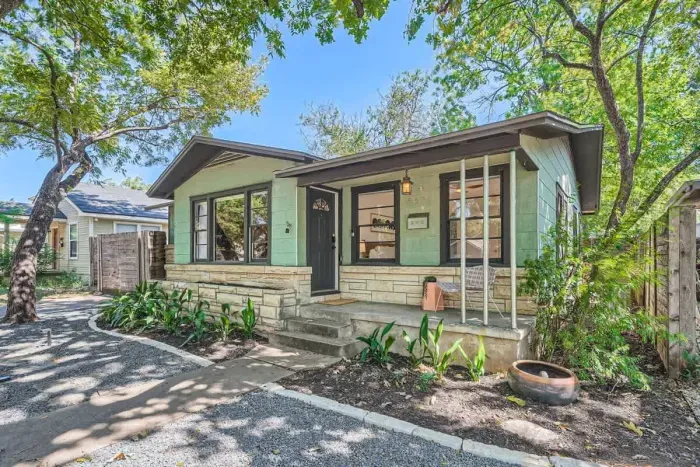 Bright and airy exterior with a mix of modern materials and natural finishes