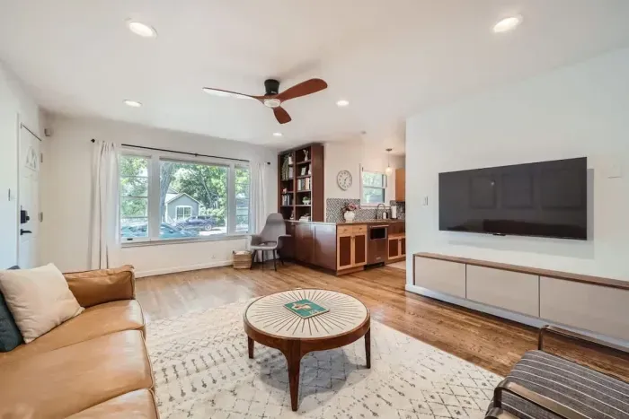 Spacious living area with comfortable couches, perfect for gathering with friends and family.