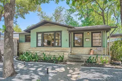 Bright and airy exterior with a mix of modern materials and natural finishes.