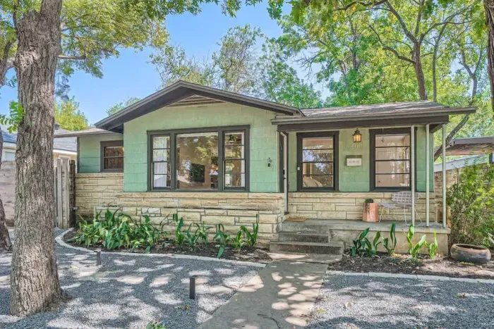 Bright and airy exterior with a mix of modern materials and natural finishes.