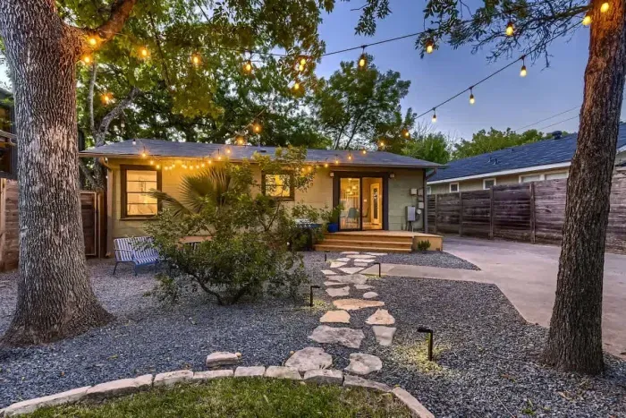Vibrant backyard with a colorful mix of plants and flowers, creating a bright and cheerful atmosphere.