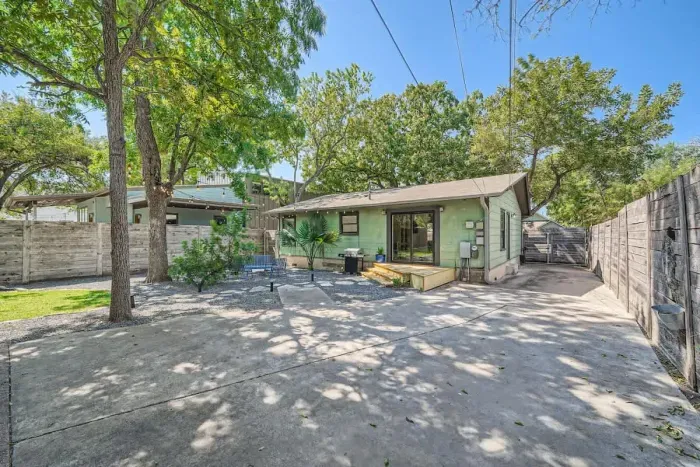 Spacious lawn with ample room for outdoor activities like frisbee, soccer, or yoga.