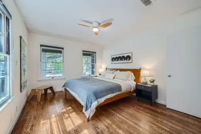 Peaceful bedroom with a plush queen-sized bed and soft linens for a restful night’s sleep.