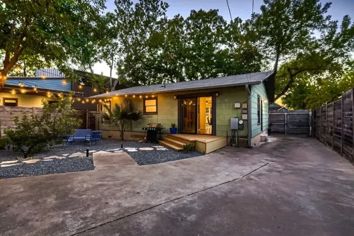 Bright and airy exterior with a mix of modern materials and natural finishes.