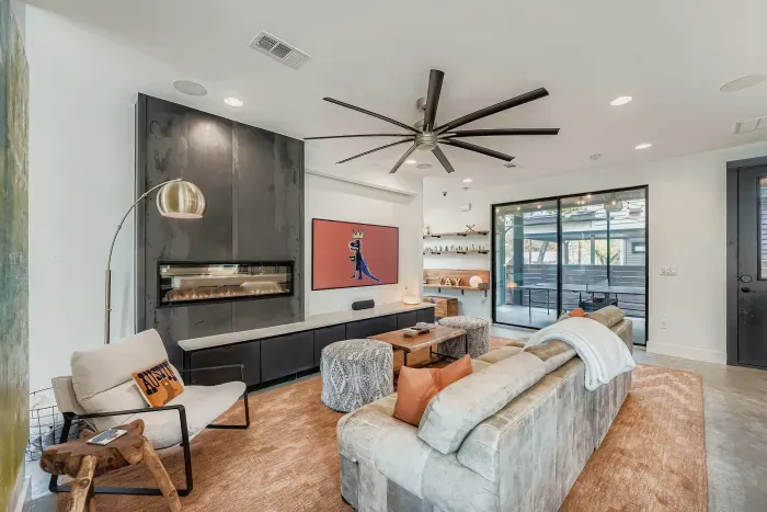 Living room with fireplace and seating.