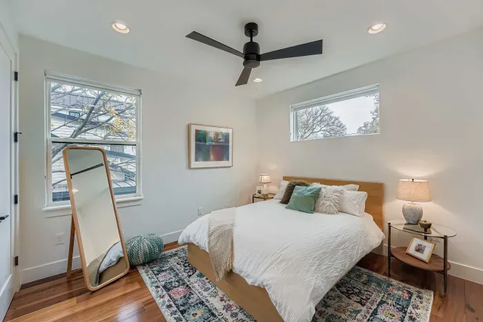 Bright guest bedroom with natural light.