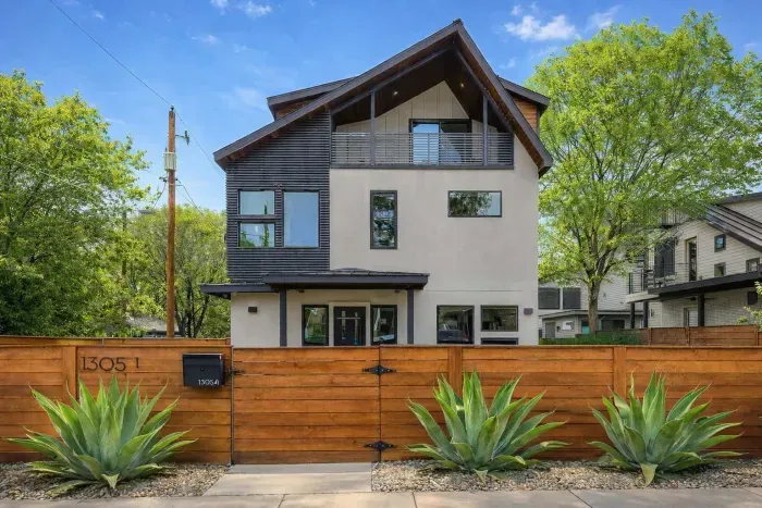 Exterior view with fenced yard.