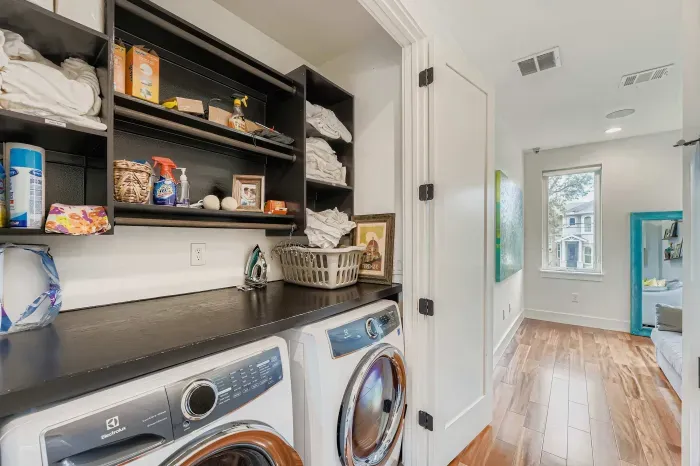 In unit laundry room with washer and dryer