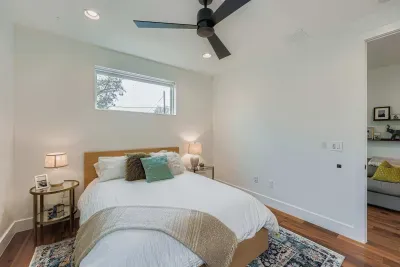 Comfortable guest bedroom with natural light.