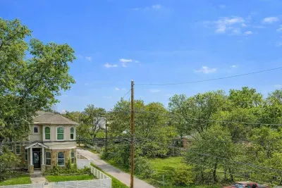 Neighborhood view with tree lined street.