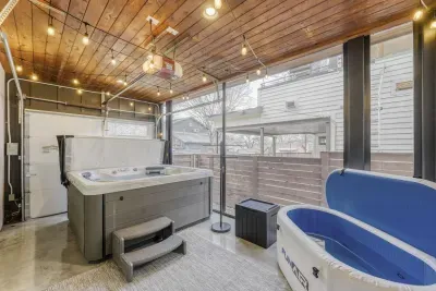 Relaxing hot tub lounge in enclosed outdoor patio.