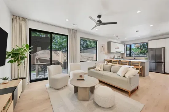 Open Concept Living Room with Kitchen and patio that has table and umbrella. TV, board games and fold out sofa for additional sleeping space!