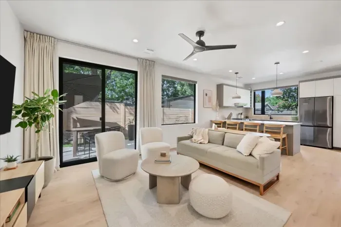 Open Concept Living Room with Kitchen and patio that has table and umbrella. TV, board games and fold out sofa for additional sleeping space!