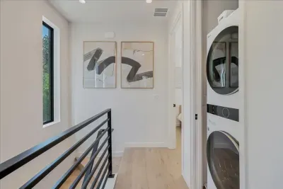 Convenient laundry area with a washer and dryer, making packing a breeze.