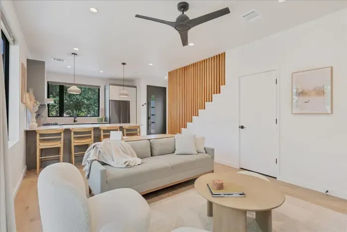 Living Room is opened off the kitchen. The four seat bar allows you eat while watching tv and interacting with those in the living room.
