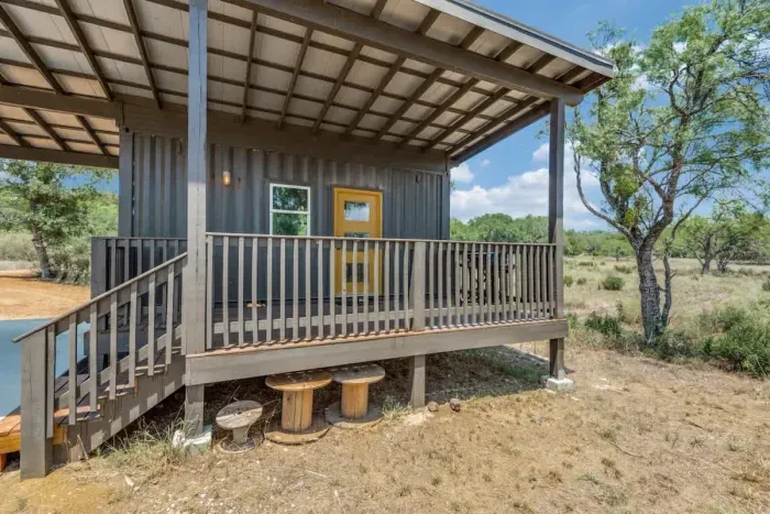 Inviting patio with plenty of seating and beautiful greenery, creating a serene outdoor retreat.