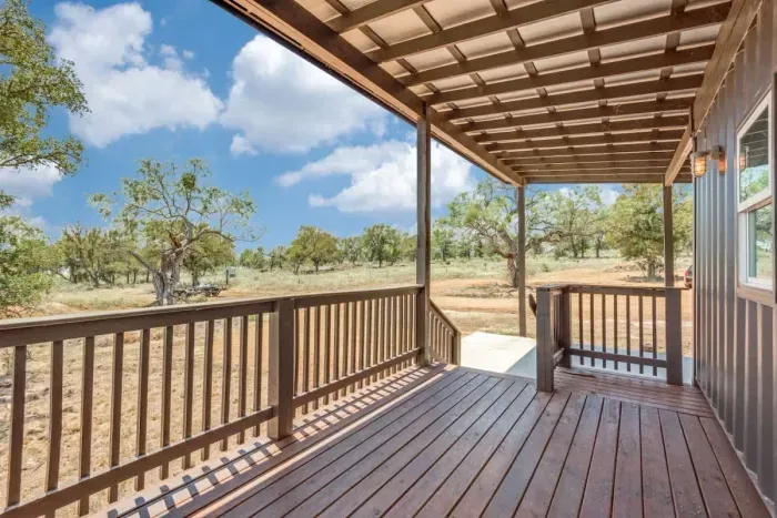 Tranquil patio with a mix of shade and sun, perfect for reading or enjoying a peaceful afternoon.