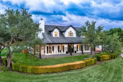 A beautifully maintained estate showcasing timeless architecture and manicured landscaping.