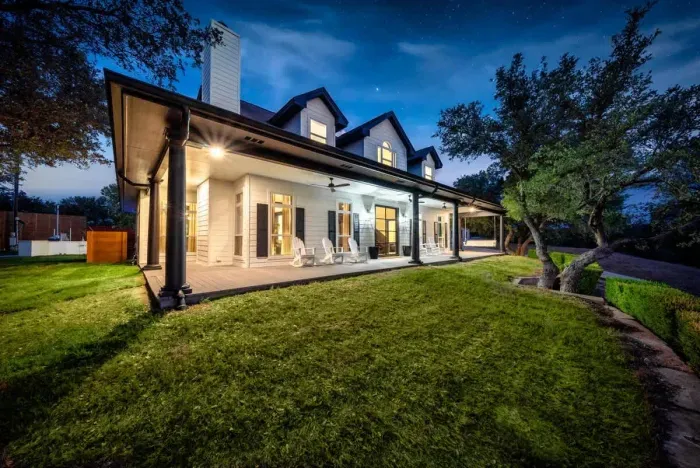 Private front porch with warm lighting and comfortable seating.