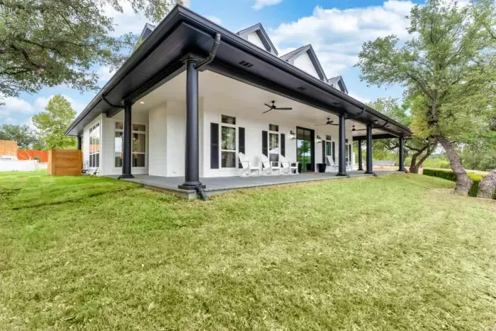 A serene patio retreat surrounded by lush greenery creating an atmosphere of pure relaxation.