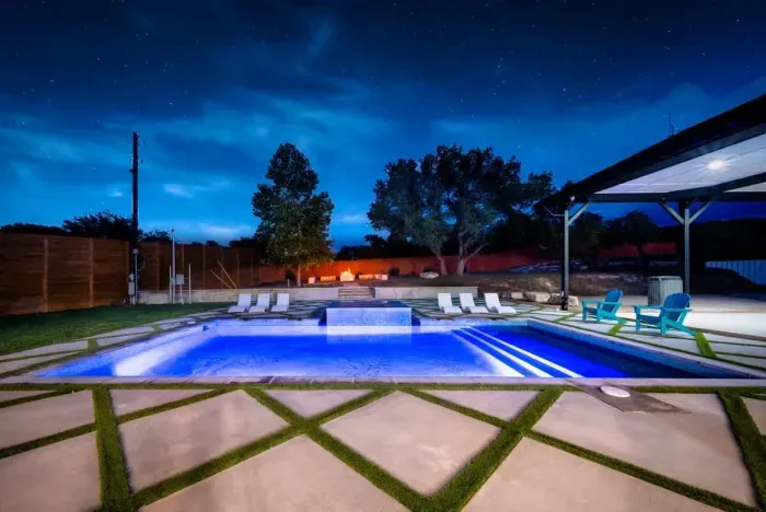 From sunrise swims to sunset dips in a sparkling heated pool surrounded by modern landscaping.