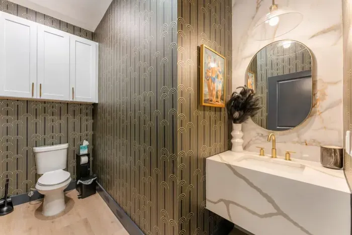 Clean and crisp bathroom with modern tile and bright lighting.