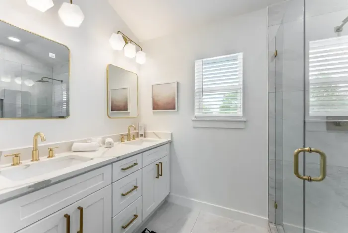 A spacious bathroom featuring premium fixtures and a calming atmosphere.