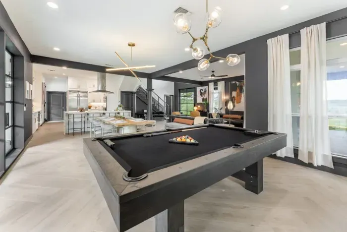 Game room fun for all ages complete with a full pool table and comfortable seating.