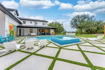 Indulge in a picture-perfect poolside escape framed by lush greenery.