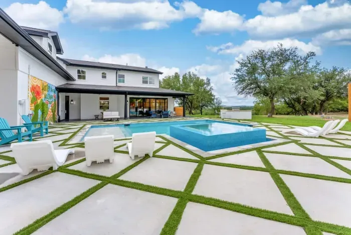 Indulge in a picture-perfect poolside escape framed by lush greenery.
