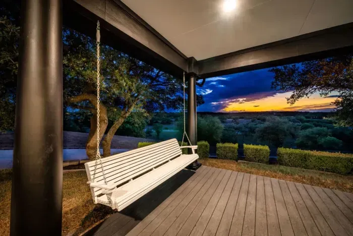 Unwind on the sophisticated front porch with sweeping sunset views.