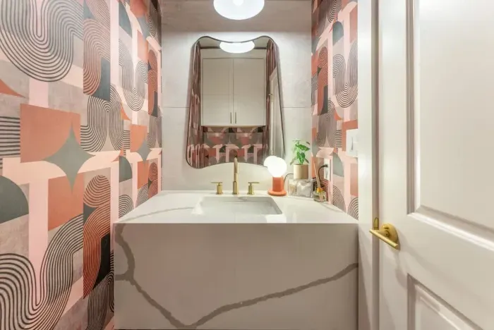 5. Charming bathroom with bold accents offering a bright playful design and updated fixtures.