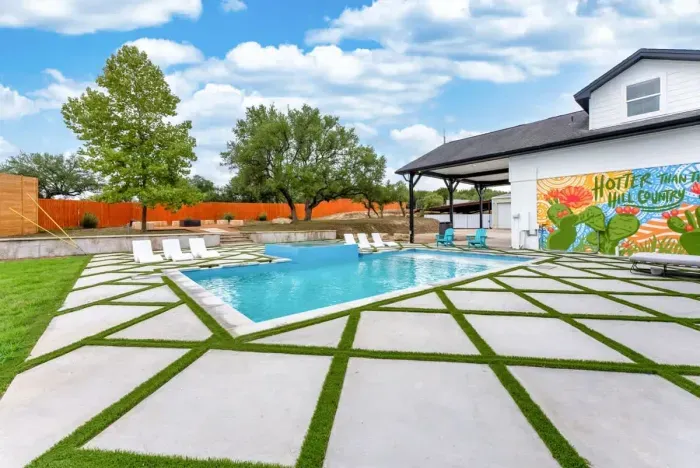 Enjoy a refreshing swim in this spacious backyard pool.
