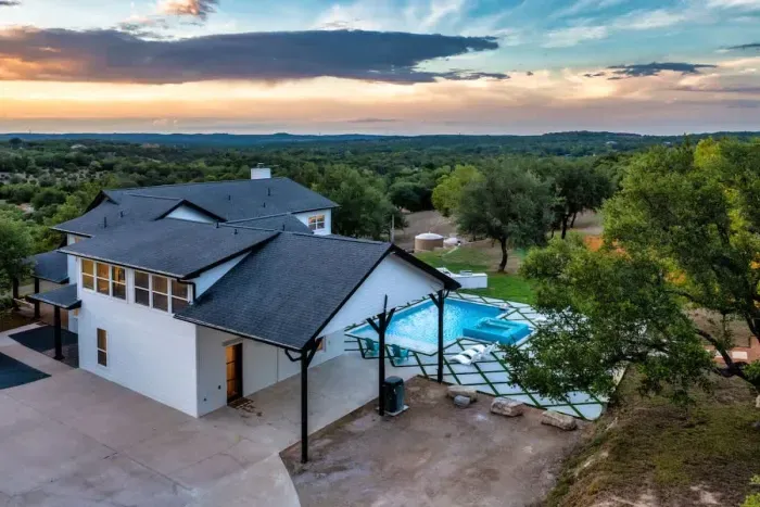 Take in the beautifully manicured exterior with stunning mountain views and lush surroundings.