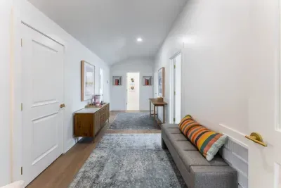 Walk through a grand hallway styled with curated décor and timeless design.