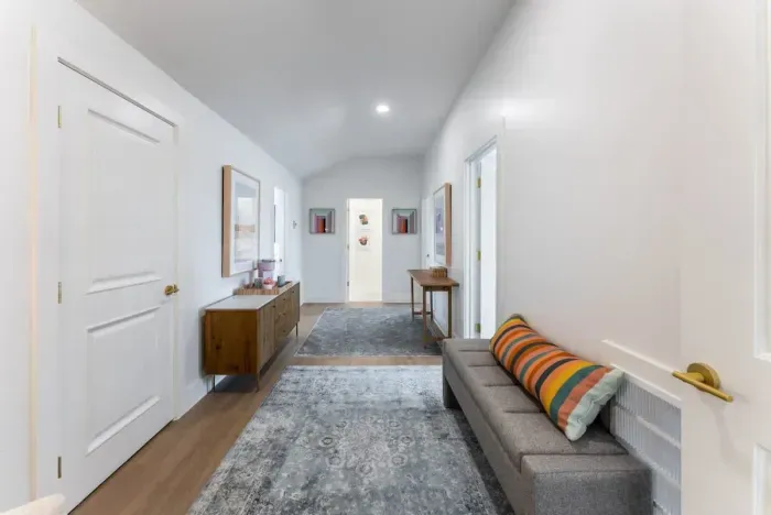 Walk through a grand hallway styled with curated décor and timeless design.